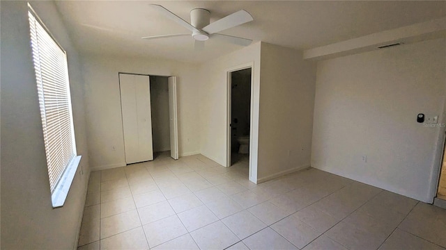 5122 Dove Dr, New Port Richey, FL 34652 - unfurnished bedroom with a closet, light tile patterned floors, and multiple windows