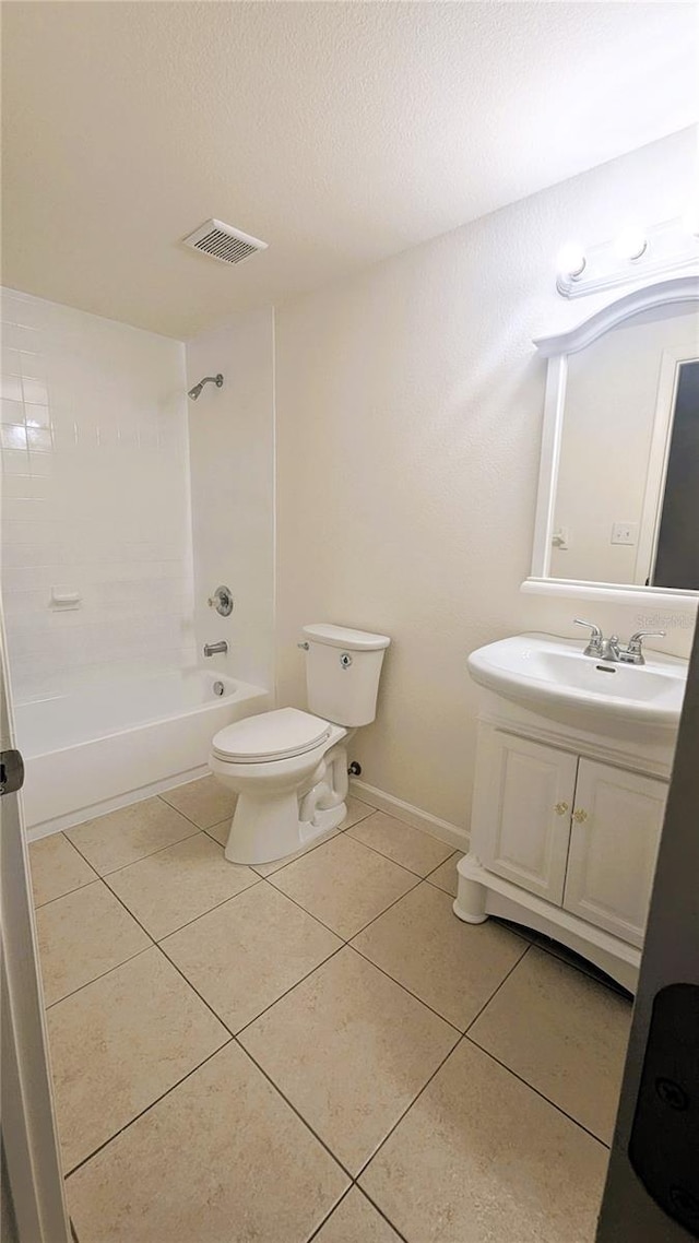 5122 Dove Dr, New Port Richey, FL 34652 - full bath featuring toilet, shower / washtub combination, vanity, visible vents, and tile patterned flooring
