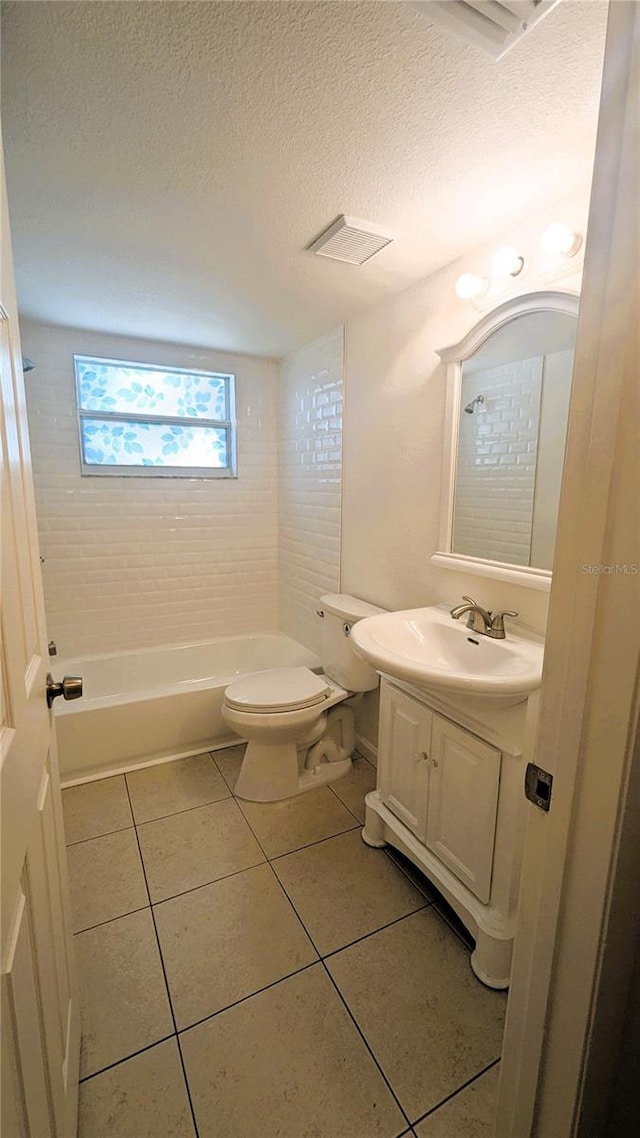 5122 Dove Dr, New Port Richey, FL 34652 - bathroom featuring tile patterned floors, toilet, vanity, and a textured ceiling