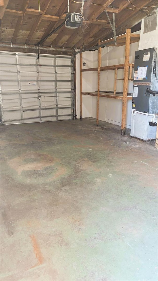 5122 Dove Dr, New Port Richey, FL 34652 - garage with heating unit and a garage door opener
