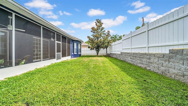 view of yard with a sunroom