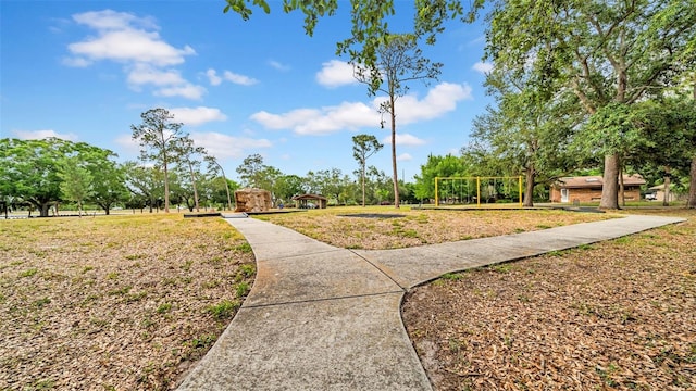 view of home's community with a yard