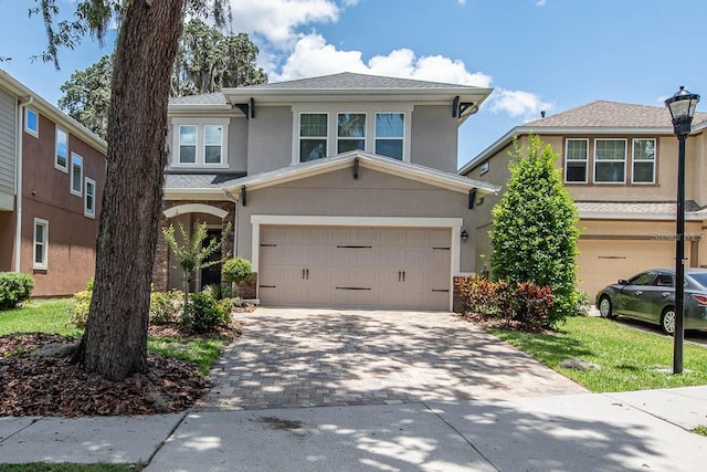 view of front of house featuring stucco siding and driveway