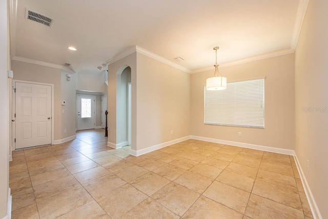 spare room featuring arched walkways, ornamental molding, baseboards, light tile patterned floors, and recessed lighting