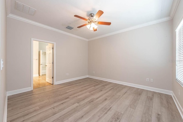 unfurnished room featuring a ceiling fan, light wood-type flooring, ornamental molding, and baseboards