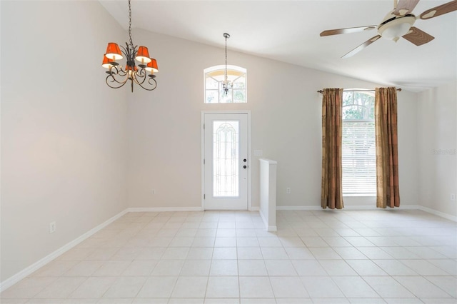 entryway featuring lofted ceiling, ceiling fan with notable chandelier, baseboards, and plenty of natural light