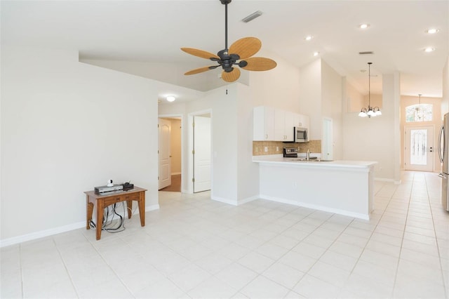unfurnished living room with ceiling fan with notable chandelier, high vaulted ceiling, visible vents, baseboards, and recessed lighting