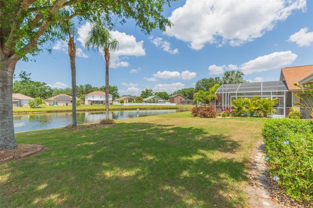 view of yard featuring a water view and a residential view