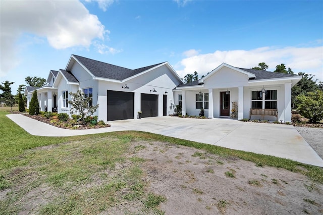 14902 Sweat Loop Rd, Wimauma, FL 33598 - modern inspired farmhouse featuring driveway, a garage, a porch, roof with shingles, and stucco siding