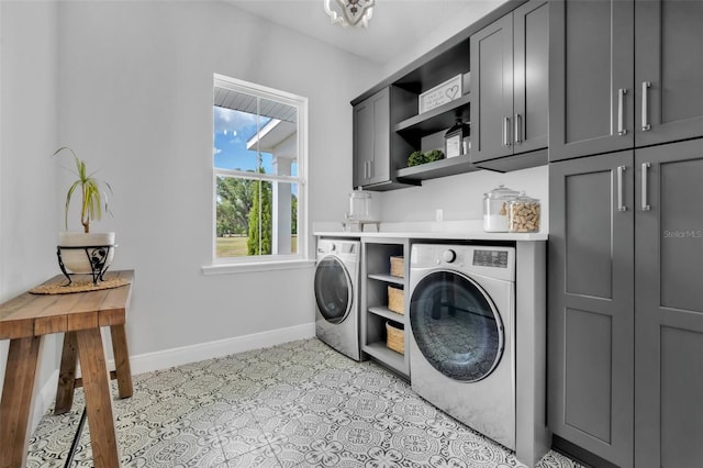 14902 Sweat Loop Rd, Wimauma, FL 33598 - clothes washing area with separate washer and dryer, cabinet space, and baseboards
