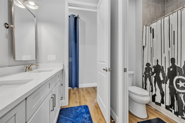 14902 Sweat Loop Rd, Wimauma, FL 33598 - full bathroom featuring wood finished floors, a shower with curtain, toilet, and double vanity