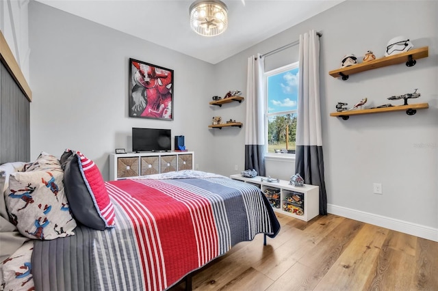 14902 Sweat Loop Rd, Wimauma, FL 33598 - bedroom with wood finished floors, baseboards, and a closet