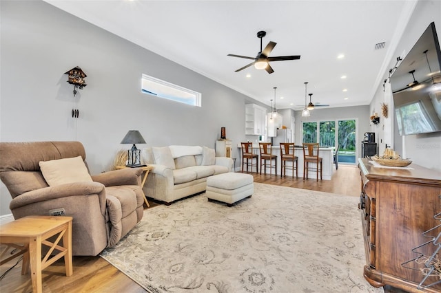 14902 Sweat Loop Rd, Wimauma, FL 33598 - living area with a ceiling fan, light wood-type flooring, recessed lighting, and ornamental molding