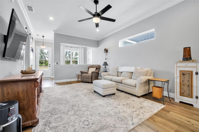 14902 Sweat Loop Rd, Wimauma, FL 33598 - living room with ornamental molding, wood finished floors, baseboards, a ceiling fan, and recessed lighting