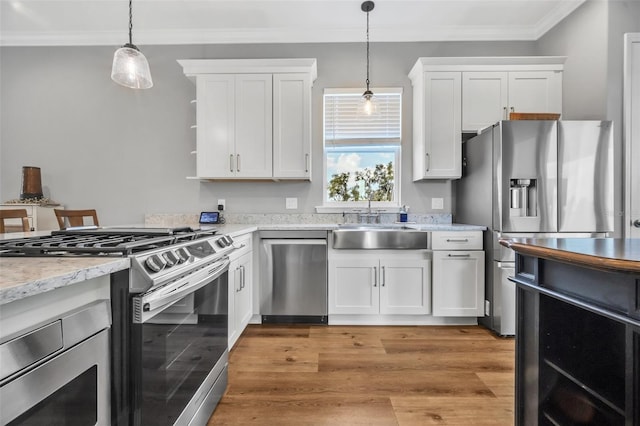 14902 Sweat Loop Rd, Wimauma, FL 33598 - kitchen featuring stainless steel appliances, a sink, white cabinets, open shelves, and crown molding