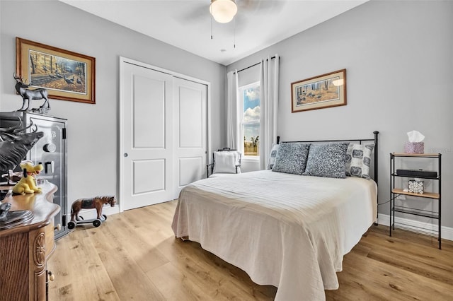 14902 Sweat Loop Rd, Wimauma, FL 33598 - bedroom with light wood-style floors, a closet, baseboards, and ceiling fan