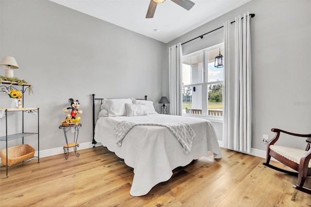 14902 Sweat Loop Rd, Wimauma, FL 33598 - bedroom featuring light wood-style flooring, baseboards, and a ceiling fan