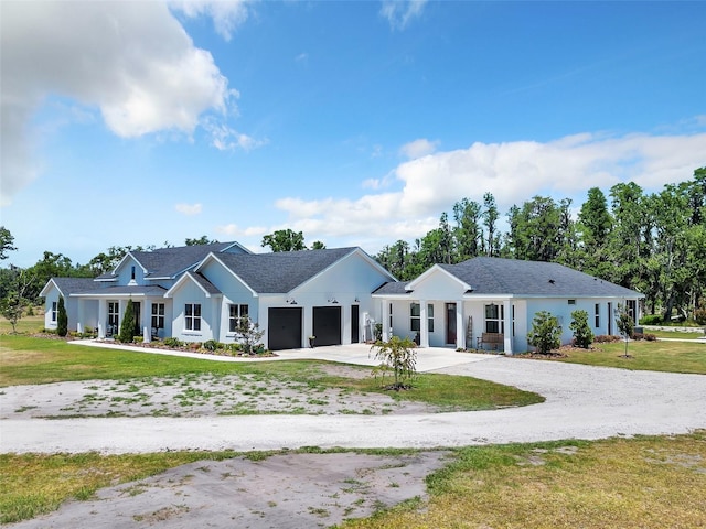 14902 Sweat Loop Rd, Wimauma, FL 33598 - view of front facade with an attached garage, driveway, and a front lawn