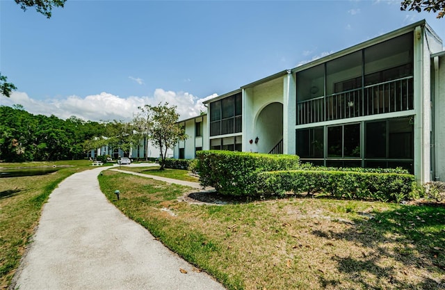 1290 Pine Ridge Cir E Unit G1, Tarpon Springs, FL 34688 - surrounding community with a lawn