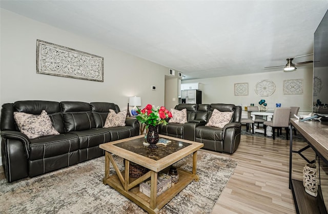 1290 Pine Ridge Cir E Unit G1, Tarpon Springs, FL 34688 - living room with light wood-style flooring