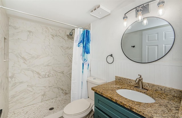 1290 Pine Ridge Cir E Unit G1, Tarpon Springs, FL 34688 - bathroom with toilet, a shower stall, vanity, and a wainscoted wall