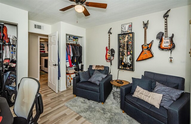 1290 Pine Ridge Cir E Unit G1, Tarpon Springs, FL 34688 - living area with light wood-style flooring and ceiling fan