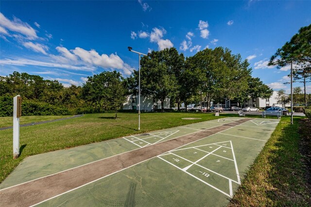 1290 Pine Ridge Cir E Unit G1, Tarpon Springs, FL 34688 - surrounding community with shuffleboard and a lawn