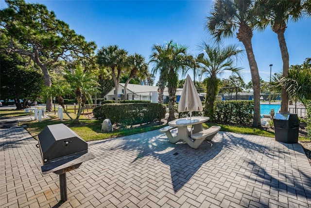 1290 Pine Ridge Cir E Unit G1, Tarpon Springs, FL 34688 - view of property's community with fence and a patio