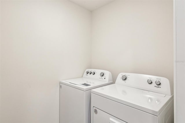 laundry area with laundry area and separate washer and dryer