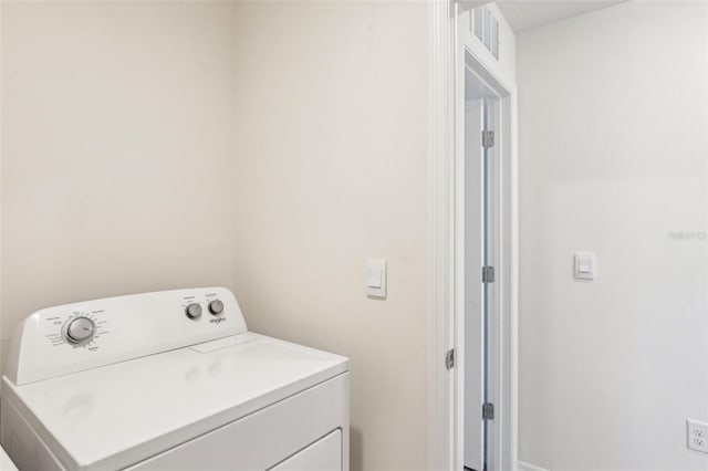 washroom featuring washer / clothes dryer and laundry area