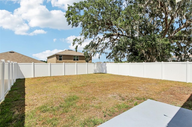 view of yard featuring a patio area and a fenced backyard