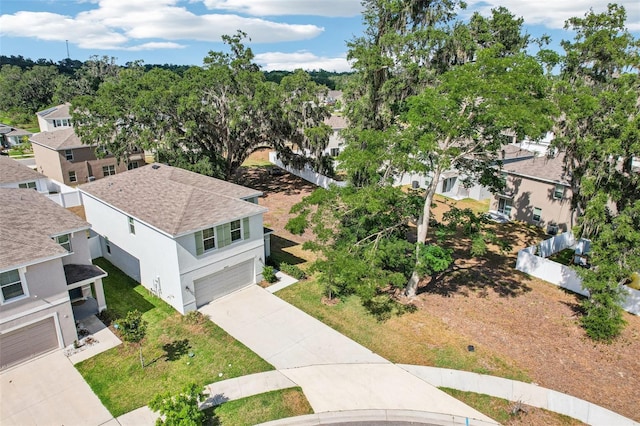 birds eye view of property with a residential view