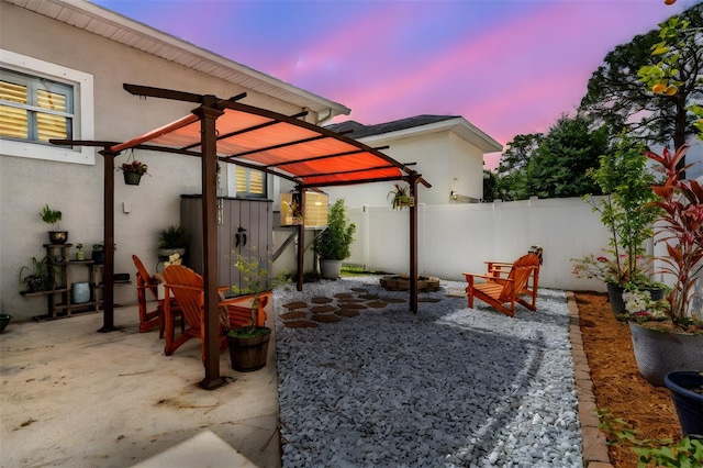 260 SW Lincoln Cir N, Saint Petersburg, FL 33703 - patio terrace at dusk featuring a fenced backyard