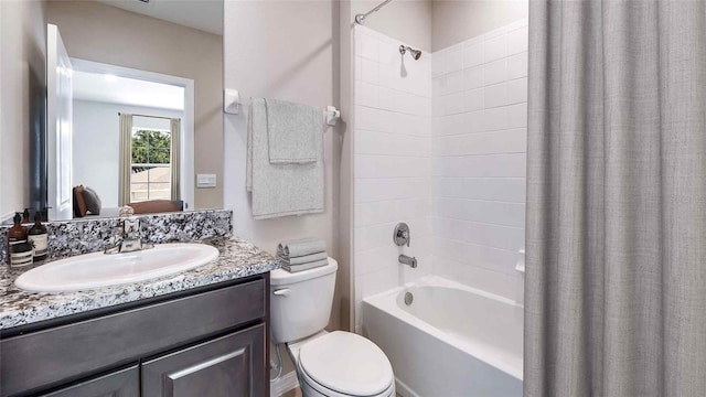 10669 Bridgegate Heights Loop, San Antonio, FL 33576 - full bath with vanity, toilet, and shower / bath combo with shower curtain