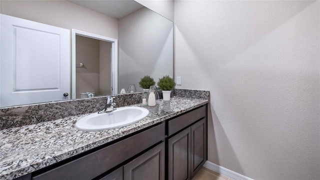 10669 Bridgegate Heights Loop, San Antonio, FL 33576 - bathroom with vanity and baseboards