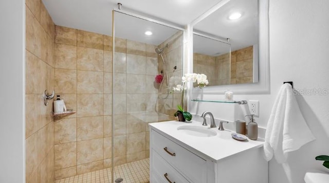 full bath with a stall shower, vanity, and recessed lighting