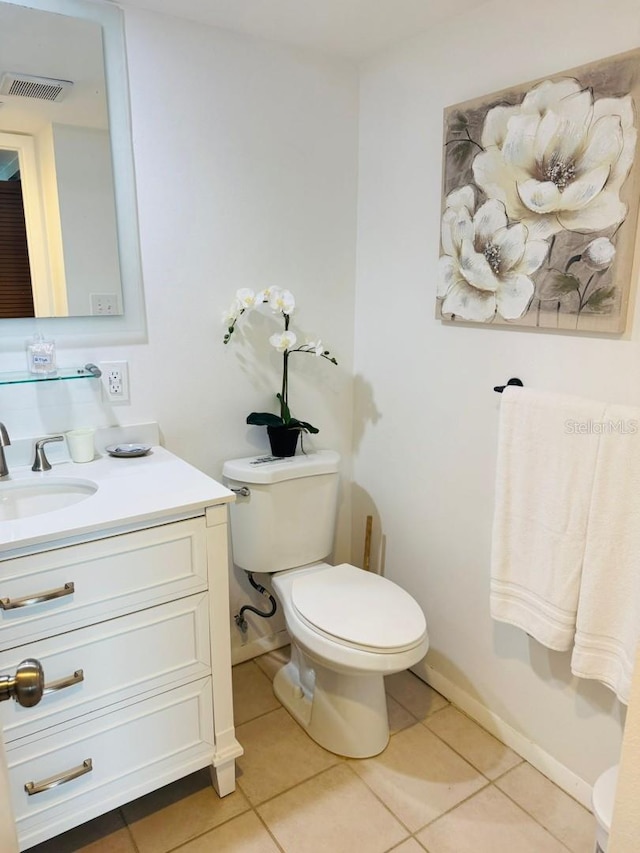 bathroom with toilet, tile patterned flooring, vanity, and visible vents