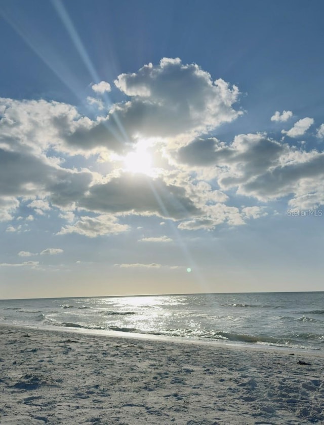 property view of water featuring a beach view