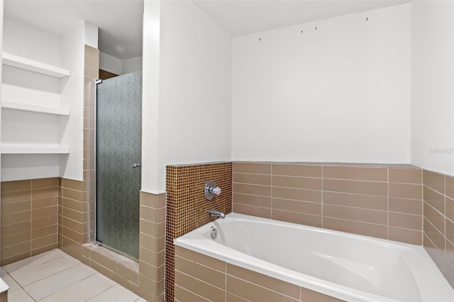 full bathroom featuring a shower stall, a garden tub, tile walls, and a wainscoted wall