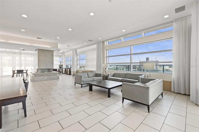 living room featuring light tile patterned floors, healthy amount of natural light, and recessed lighting
