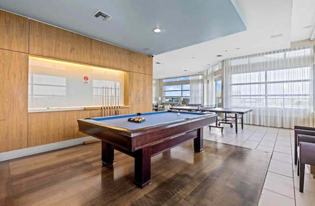 playroom featuring pool table and wood walls