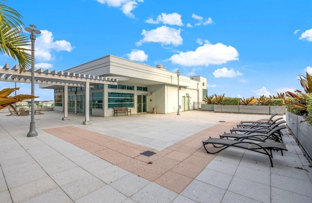 view of patio / terrace featuring a pergola and fence