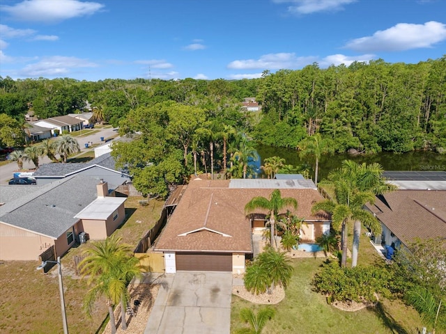 birds eye view of property with a forest view