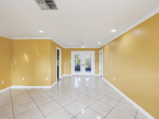 empty room with french doors, visible vents, light tile patterned flooring, ornamental molding, and recessed lighting