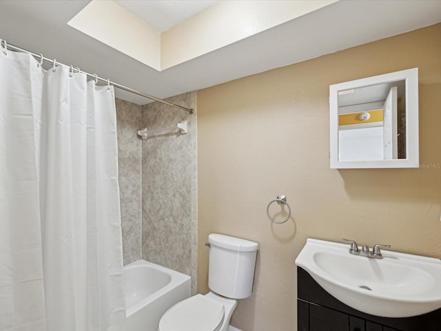 bathroom featuring vanity, toilet, and shower / bath combo