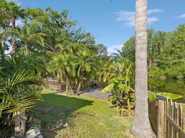 view of yard with fence and a wooden deck