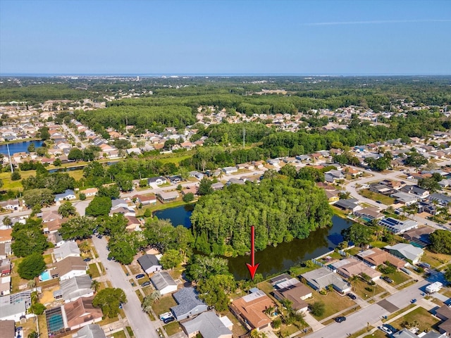 birds eye view of property featuring a water view and a residential view