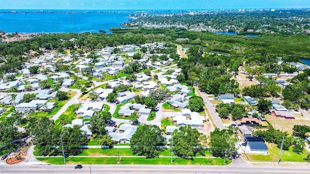 aerial view of residential area with a large body of water