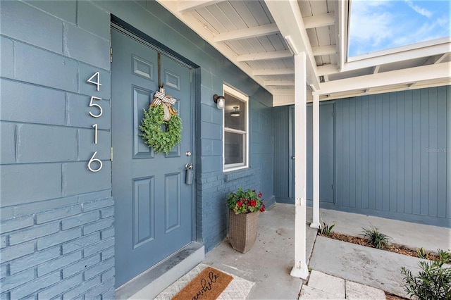 doorway to property featuring a porch