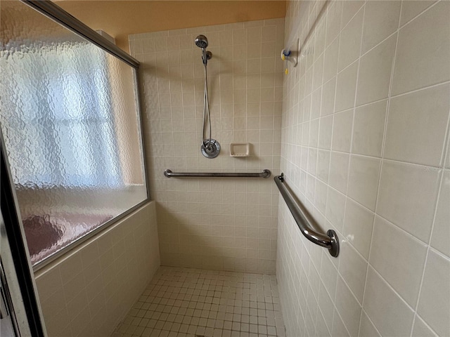 bathroom with tiled shower